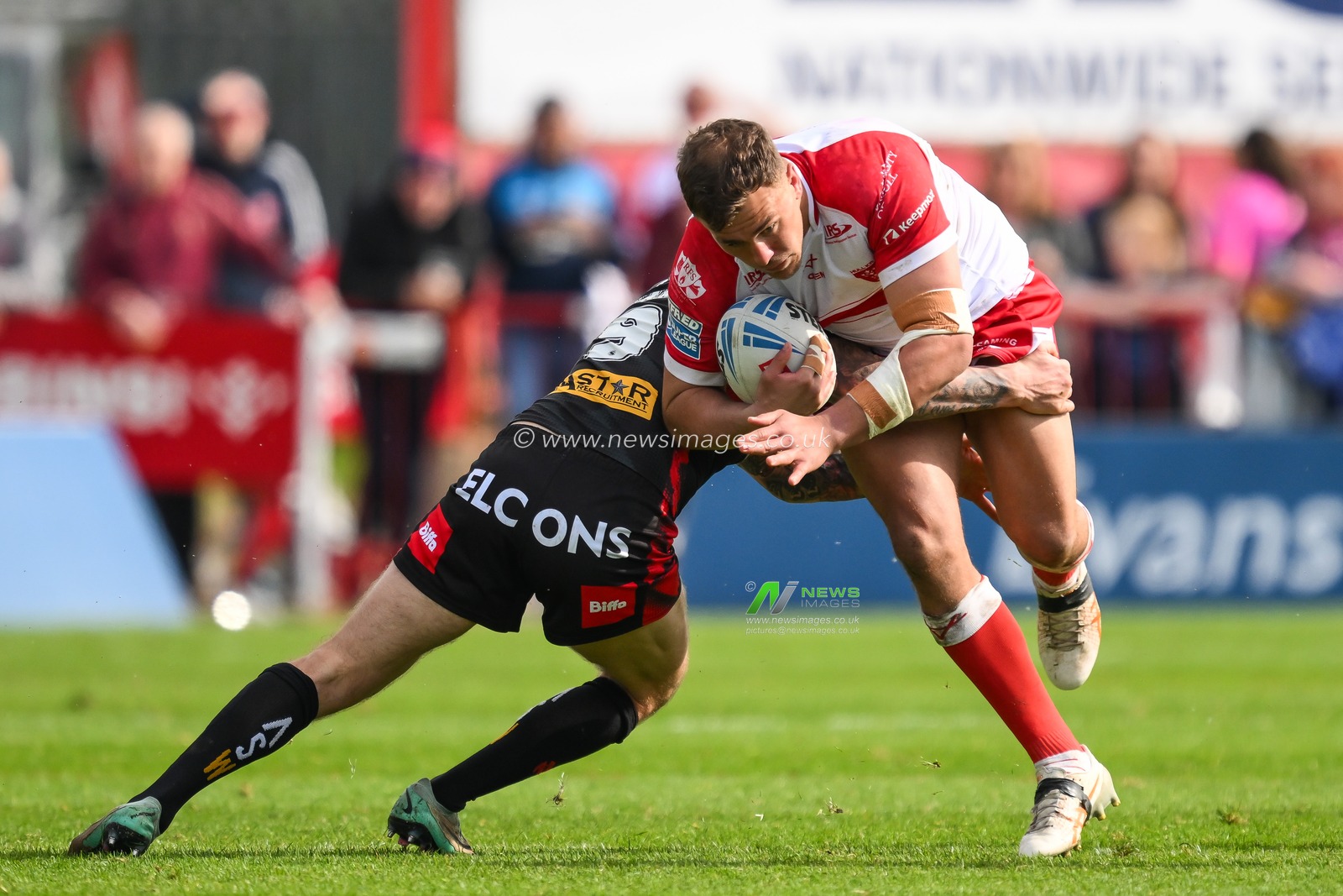 Jai Whitbread of Hull KR is tackled by Daryl Clark of St. Helens during the Betfred Super League Round 10 match Hull KR vs St Helens at Sewell Group Craven Park, Kingston upon Hull, United Kingdom, 4th May 2024

(Photo by Craig Thomas/News Images)