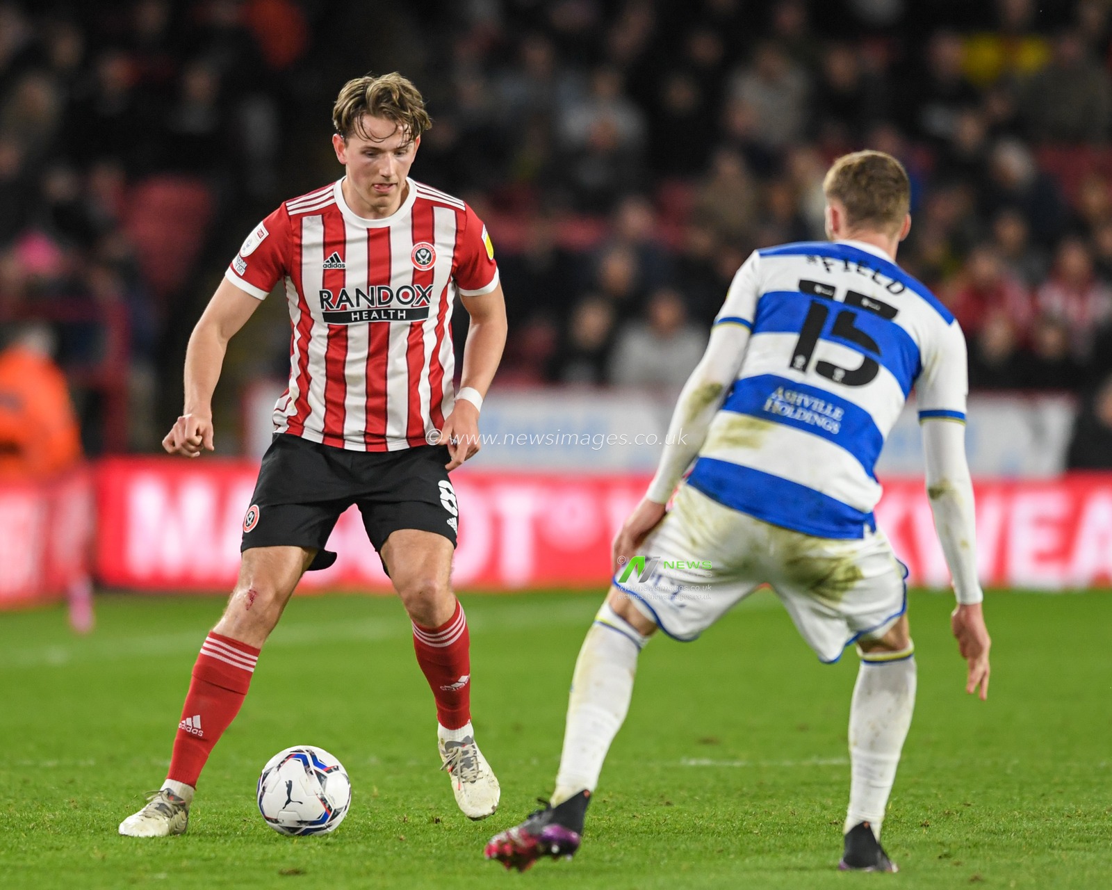 Sander Berge #8 of Sheffield United looks for a way past Sam Field #15 of Queens Park Rangers
