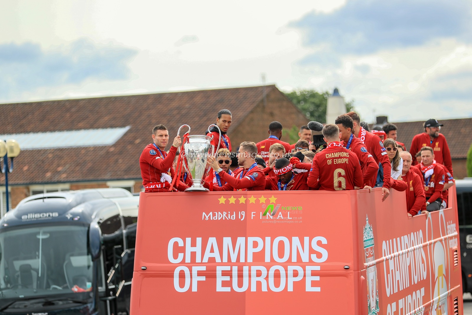 2nd June 2019 , Liverpool, England; UEFA Champions League, Liverpool FC Champions League winners celebrations and open top bus parade ; Liverpool squad on their victory parade as James Milner (07) of Liverpool and â€˜Jordan Henderson (14) of Liverpool hold the Eropean cup 


Credit: Mark Cosgrove/News Images