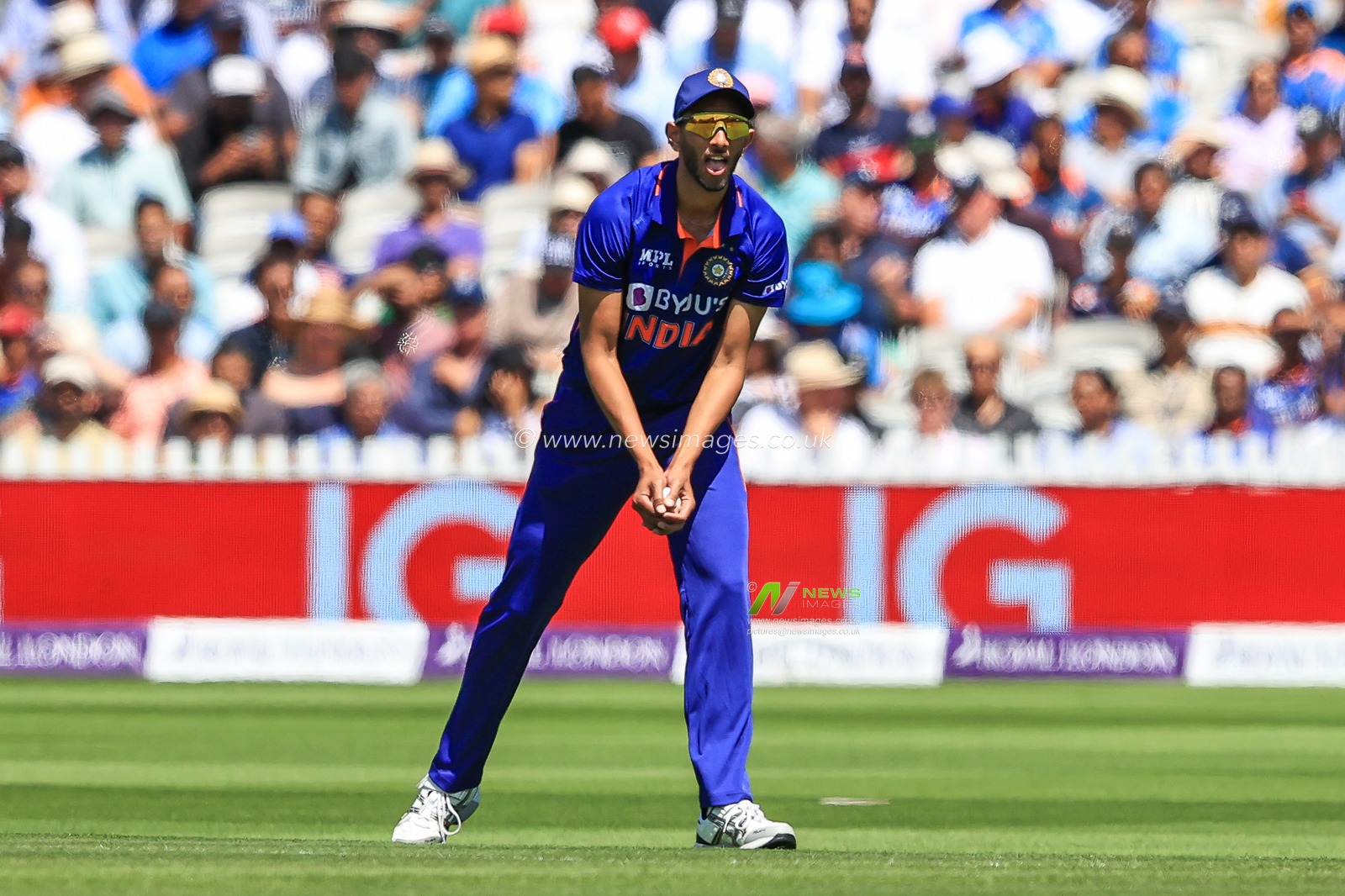 Prasidh Krishna of India collects the ball in the field