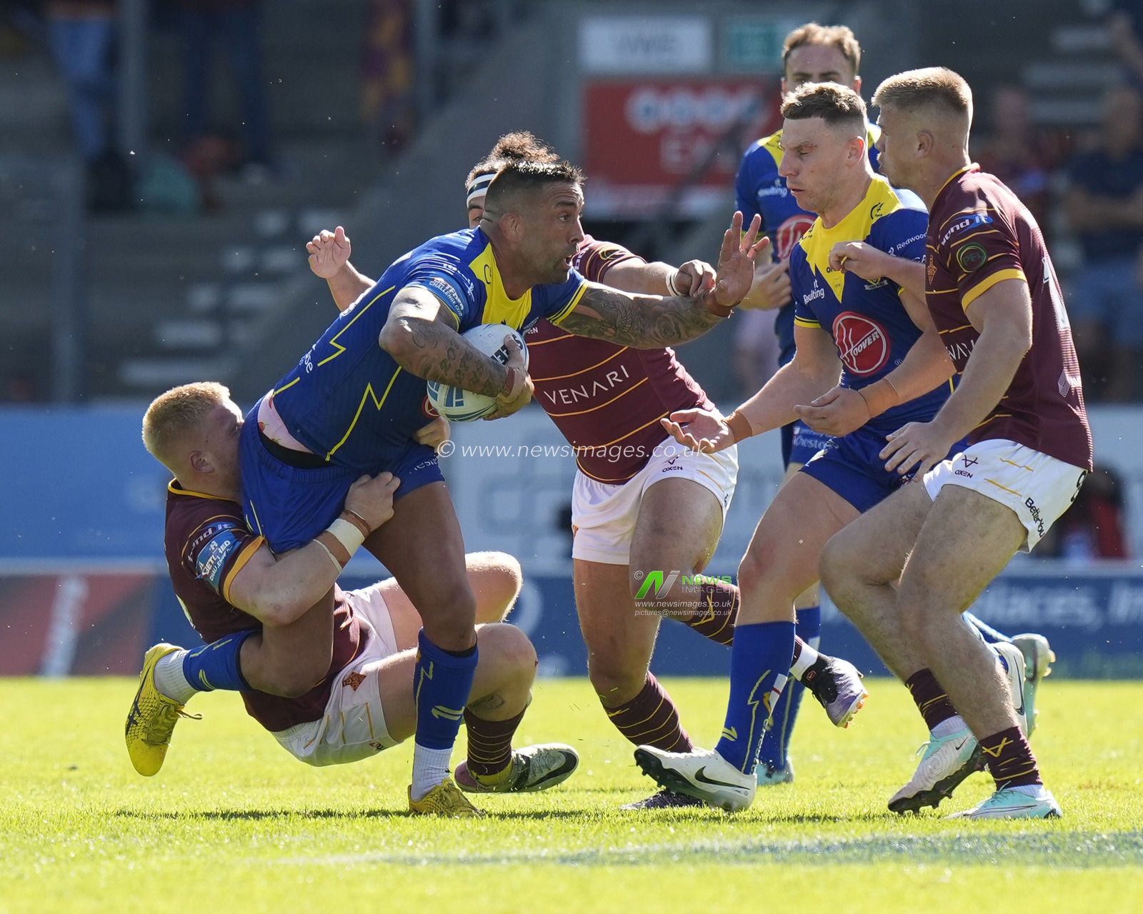 Paul Vaughan of Warrington Wolves runs at the Huddersfield Giants defence during the Betfred Challenge Cup Semi-Final match Huddersfield Giants vs Warrington Wolves at Totally Wicked Stadium, St Helens, United Kingdom, 19th May 2024

(Photo by Steve Flynn/News Images)