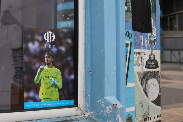 Official matchday programs with Manchester City goalkeeper James Trafford on the front cover are on sale outside the Etihad Stadium during the Emirates FA Cup Quarter-Final match Manchester City vs Liverpool at Etihad Stadium, Manchester, United Kingdom on 04 April 2026

(Photo by Mark Cosgrove/News Images)