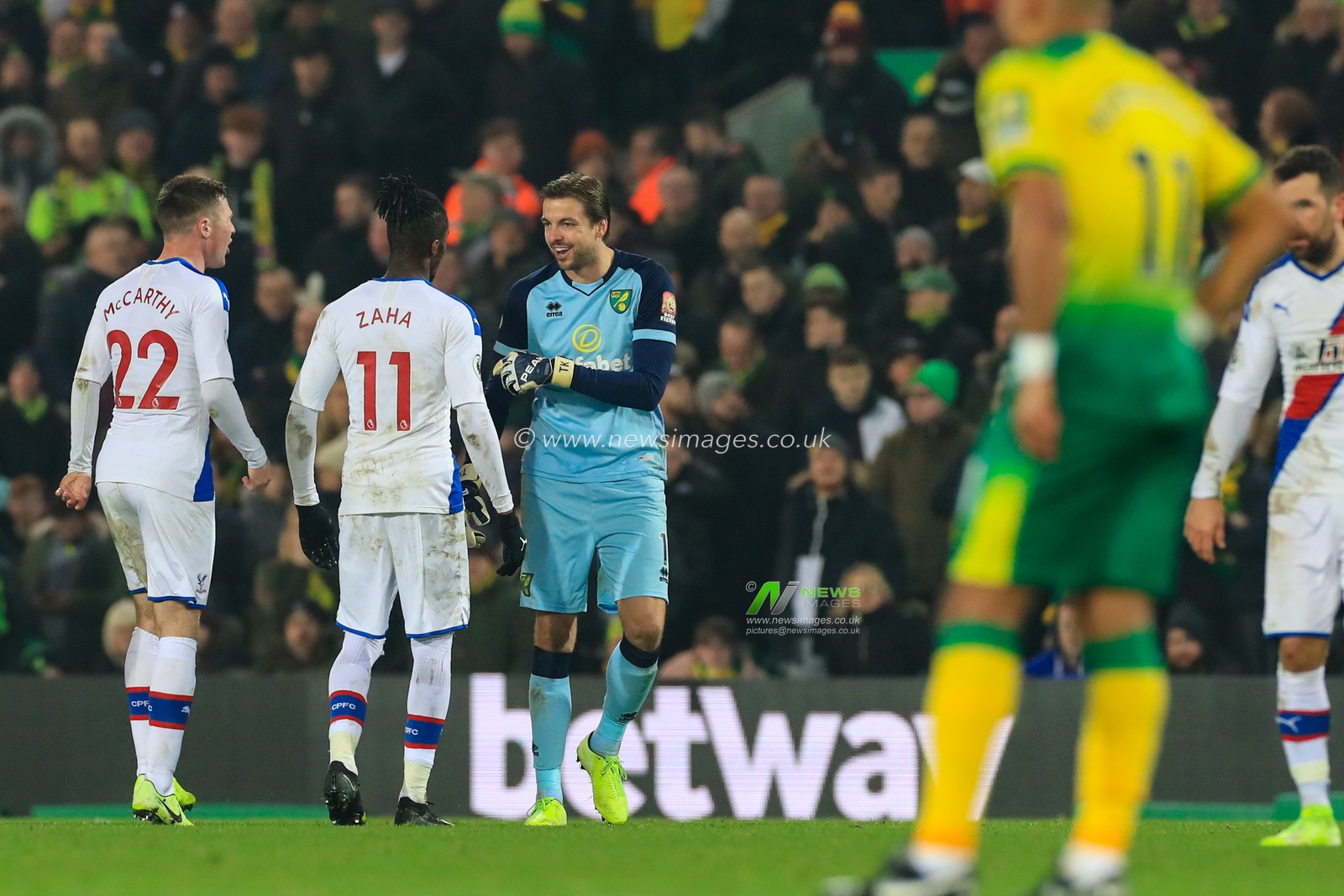 1st January 2020, Carrow Road, Norwich, England; Premier League, Norwich City v Crystal Palace : Tim Krul (01) of Norwich City and Wilfried Zaha (11) of Crystal Palace exchange words after Crystal Palace are awarded a goal to make it 1-1.


Credit: Georgie Kerr/News Images