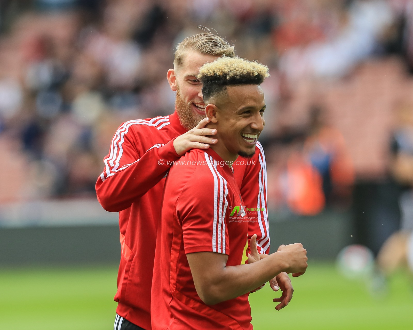 18th August 2019 , Bramall Lane, Sheffield, England; Premier League Football, Sheffield United vs Crystal Palace ; Oliver McBurnie (9) of Sheffield United teases Callum Robinson (11) of Sheffield United over the tram lines in his new haircut 


Credit: Mark Cosgrove/News Images

English Football League images are subject to DataCo Licence