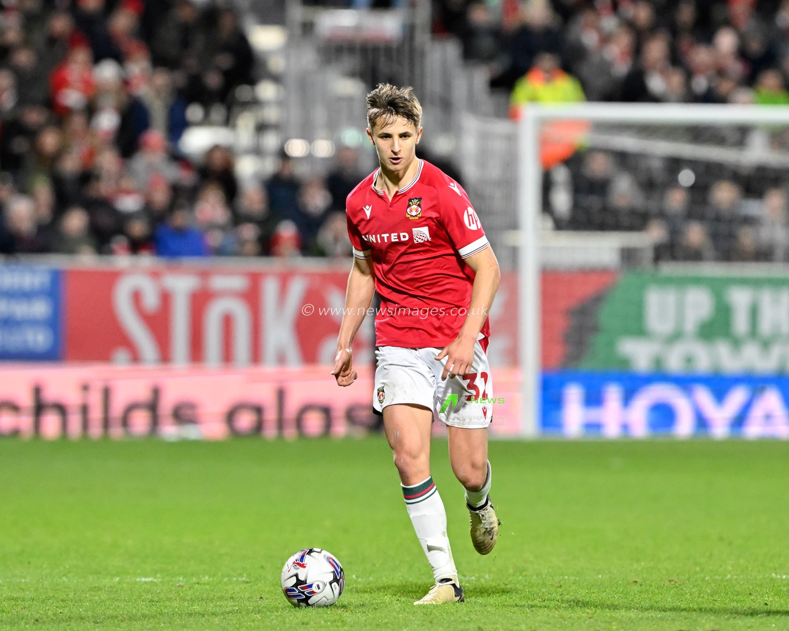 Max Cleworth of Wrexham breaks forward with the ball, during the Sky Bet League 2 match Wrexham vs Harrogate Town at SToK Cae Ras, Wrexham, United Kingdom, 12th March 2024

(Photo by Cody Froggatt/News Images)