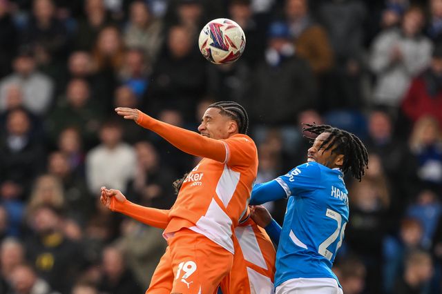 Sammy Slivera of Blackpool and Micah Hamilton of Stockport County battle for the Haigh ball during the Sky Bet League 1 match Stockport County vs Blackpool at Edgeley Park Stadium, Stockport, United Kingdom, 1st March 2025

(Photo by Craig Thomas/News Images)