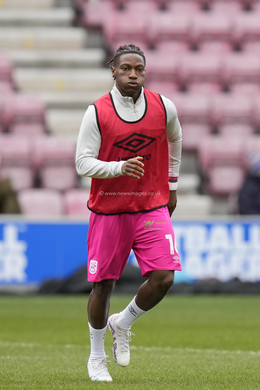Joseph Hungbo #16 of Huddersfield Town warms up before the Sky Bet Championship match Wigan Athletic vs Huddersfield Town at DW Stadium, Wigan, United Kingdom, 11th February 2023

(Photo by Steve Flynn/News Images)