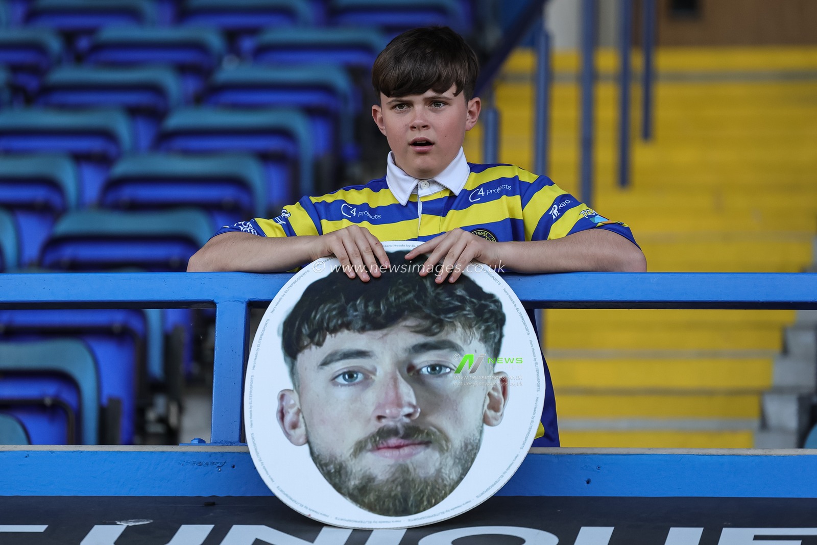 A young Wire fan with a Matty Ashton of Warrington Wolves head banner during the Betfred Super League round 9 match Warrington Wolves vs Wigan Warriors at The Halliwell Jones Stadium, Warrington, United Kingdom on 24 April 2026

(Photo by Mark Cosgrove/News Images)