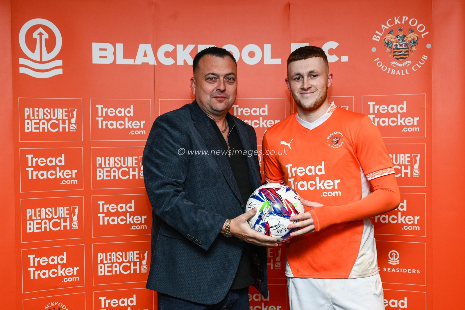Sonny Carey of Blackpool presents a sponsor with a signed ball after the Sky Bet League 1 match Blackpool vs Leyton Orient at Bloomfield Road, Blackpool, United Kingdom, 15th March 2025

(Photo by Craig Thomas/News Images)