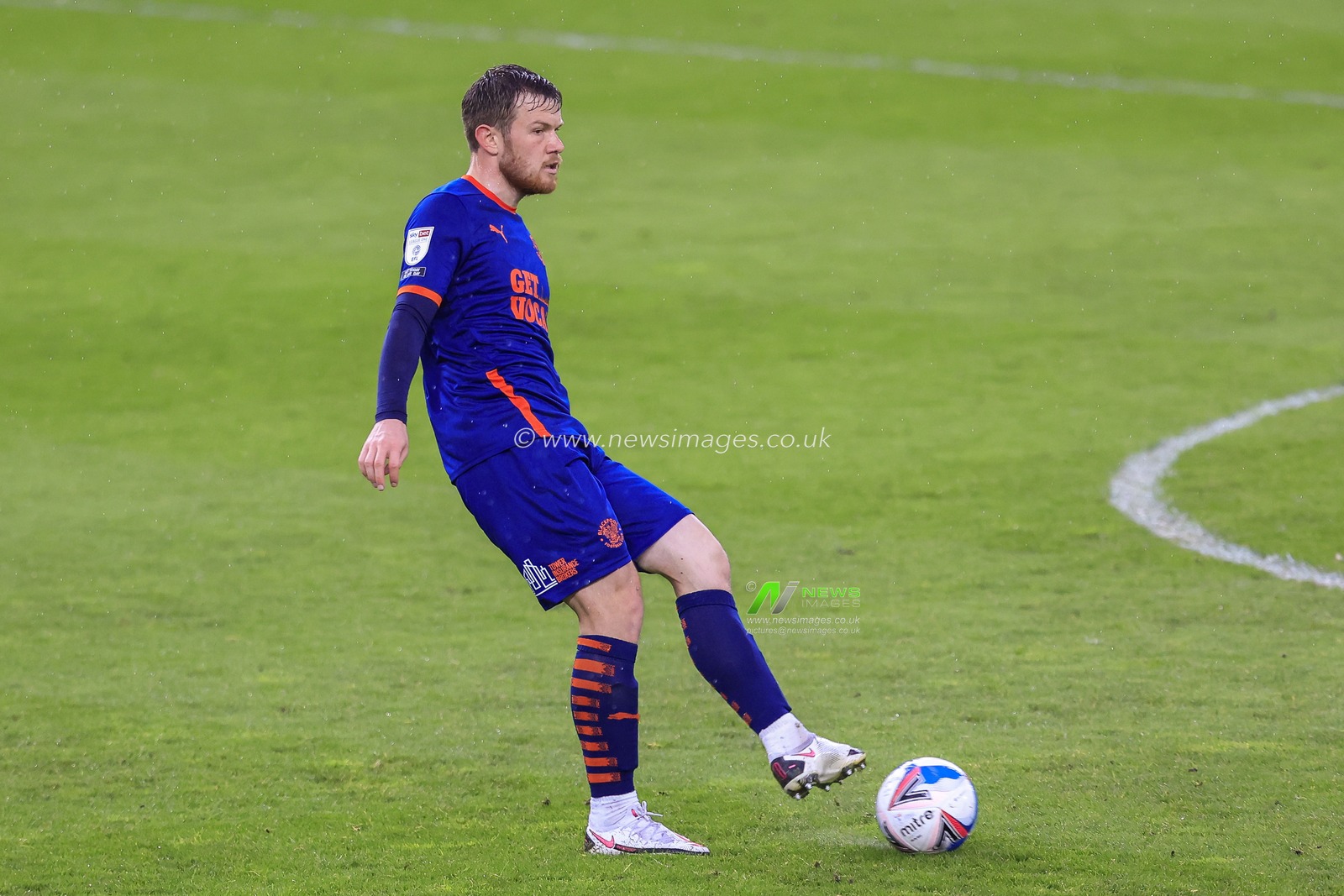 Jordan Thorniley #4 of Blackpool with the ball