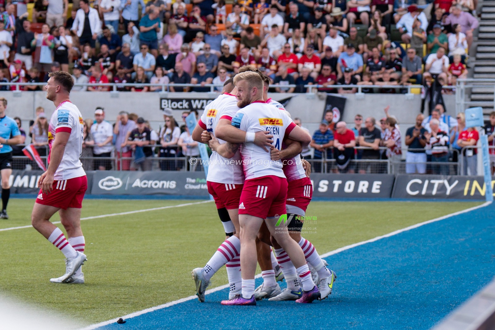 Danny Care #9 of Harlequins celebrates scoring a try with his team mates