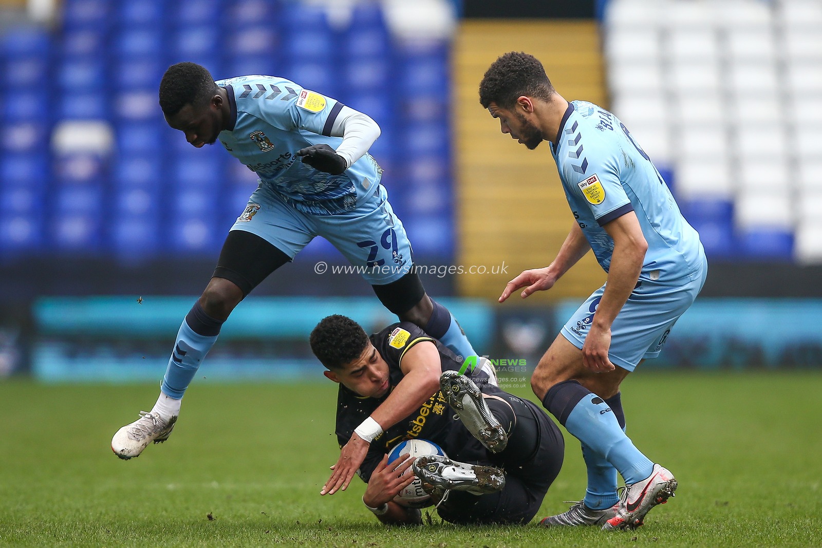 Adam Masina #11 of Watford is fouled by Julien Dacosta #29 of Coventry City