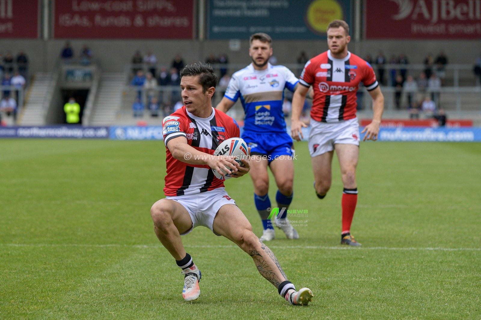Morgan Escare (1) of Salford Red Devils with the ball