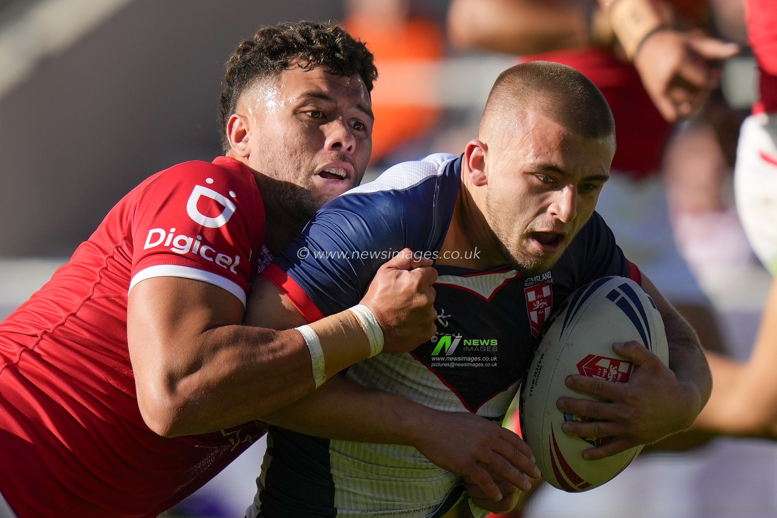 Starford To'a #2 of Tonga tackles Mikey Lewis #6 of England makes a break during the Rugby League International match England vs Tonga at Totally Wicked Stadium, St Helens, United Kingdom, 22nd October 2023

(Photo by Steve Flynn/News Images)