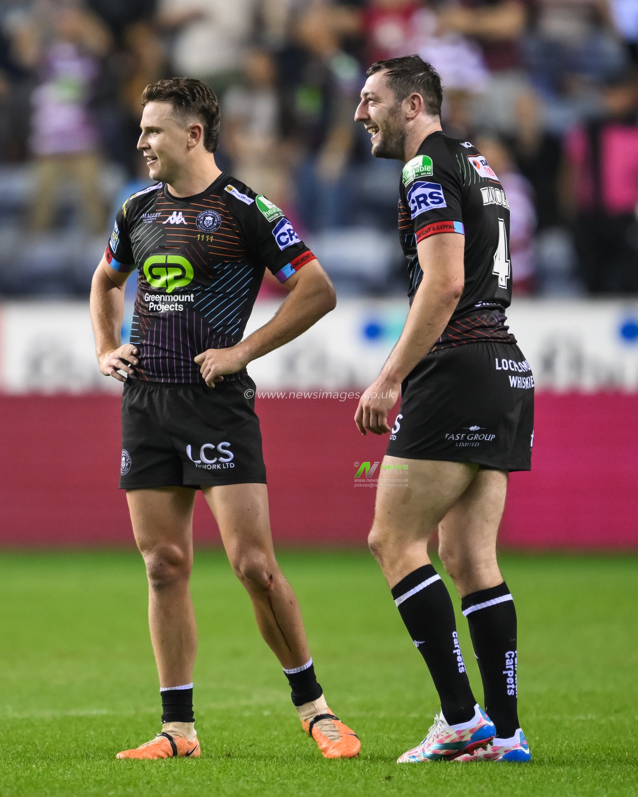 Jai Field of Wigan Warriors and Jake Wardle of Wigan Warriors celebrate winning the Betfred Super League Round 25 match Wigan Warriors vs Hull KR at The Brick Community Stadium, Wigan, United Kingdom, 6th September 2024

(Photo by Craig Thomas/News Images)