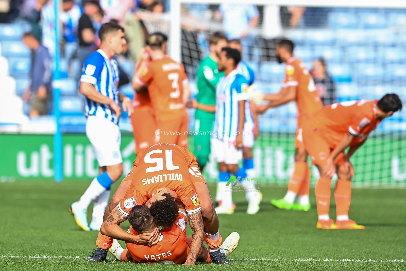 Jerry Yates #9 and Rhys Williams #15 of Blackpool celebrate at the final whistle of the Sky Bet Championship match Huddersfield Town vs Blackpool at John Smith's Stadium, Huddersfield, United Kingdom, 4th September 2022

(Photo by Craig Thomas/News Images)