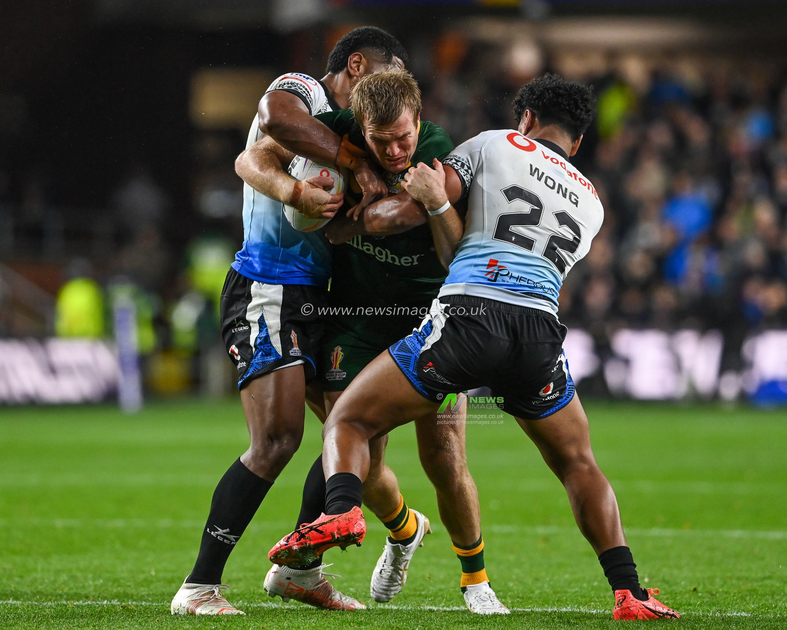 Jake Trbojevic of Australia is tackled by Josh Wong and Tui Kamikamica of Fiji during the Rugby League World Cup 2021 match Australia vs Fiji at Headingley Stadium, Leeds, United Kingdom, 15th October 2022

(Photo by Craig Thomas/News Images)