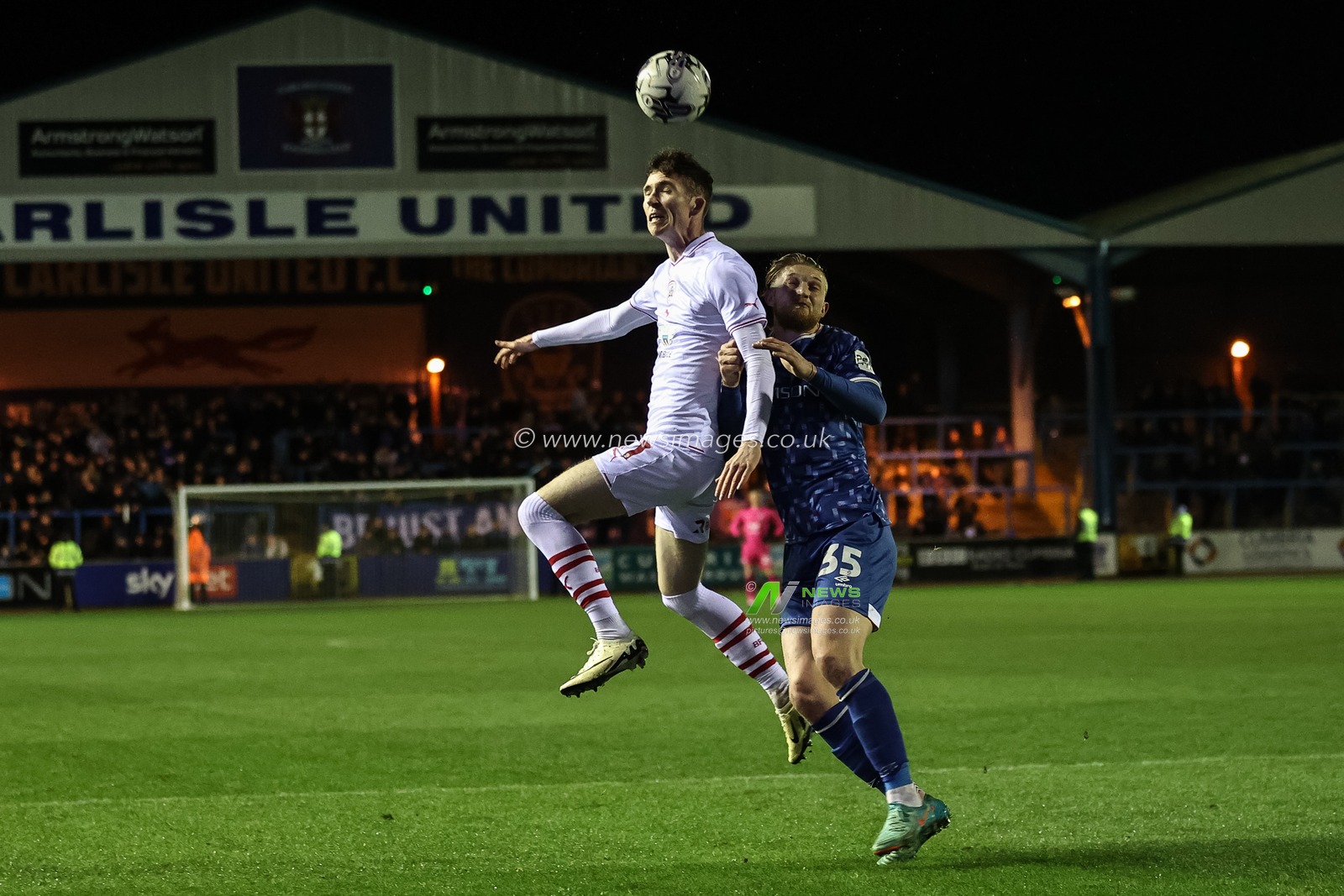 Conor Grant of Barnsley jumps up to win the high ball during the Sky Bet League 1 match Carlisle United vs Barnsley at Brunton Park, Carlisle, United Kingdom, 12th March 2024

(Photo by Mark Cosgrove/News Images)