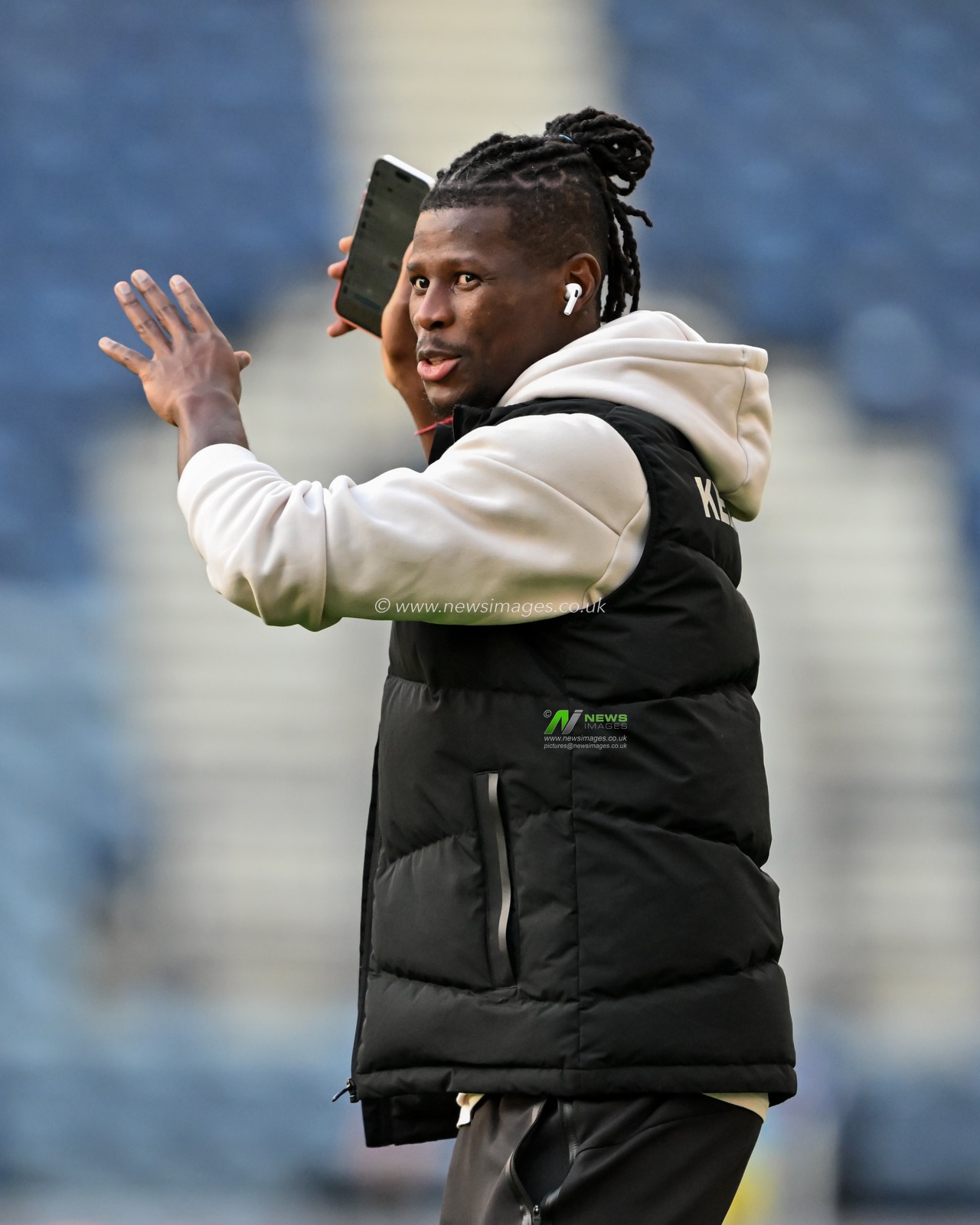 Tom Dele-Bashiru of Watford inspects the pitch ahead of the Sky Bet Championship match Preston North End vs Watford at Deepdale, Preston, United Kingdom, 2nd October 2024

(Photo by Cody Froggatt/News Images)