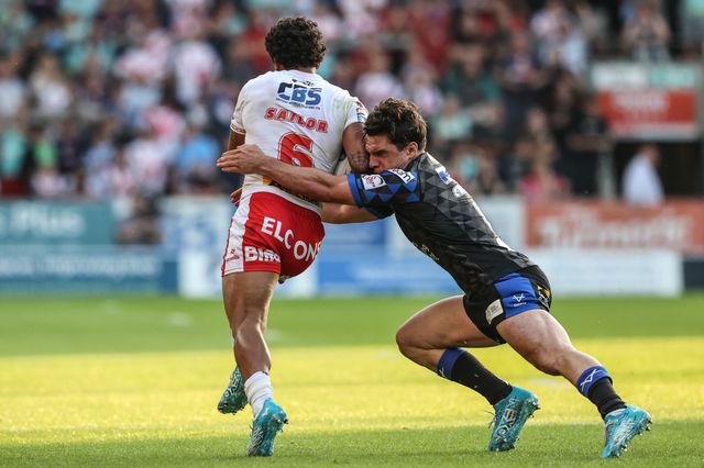 Tristan Sailor of St. Helens is tackled by Brodie Croft of Leeds Rhinos during the Betfred Super League round 15 match St Helens vs Leeds Rhinos at Totally Wicked Stadium, St Helens, United Kingdom, 20th June 2025

(Photo by Alfie Cosgrove/News Images)