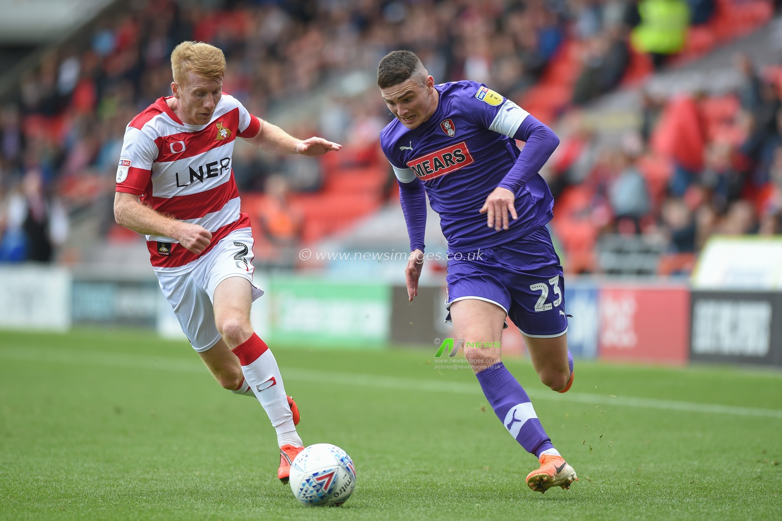 7th September 2019, Keepmoat Stadium, Doncaster, England; Sky Bet League One Football, Doncaster Rovers vs Rotherham United ; Jake Hastie (23) of Rotherham United  takes on Brad Halliday (2) of Doncaster Rovers 

Credit: Dean Williams/News Images

English Football League images are subject to DataCo Licence