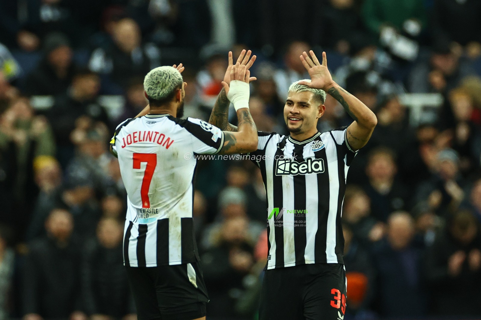 Joelinton #7 of Newcastle United celebrates his goal to make it 1-0 during the UEFA Champions League match Newcastle United vs AC Milan at St. James's Park, Newcastle, United Kingdom, 13th December 2023

(Photo by Mark Cosgrove/News Images)