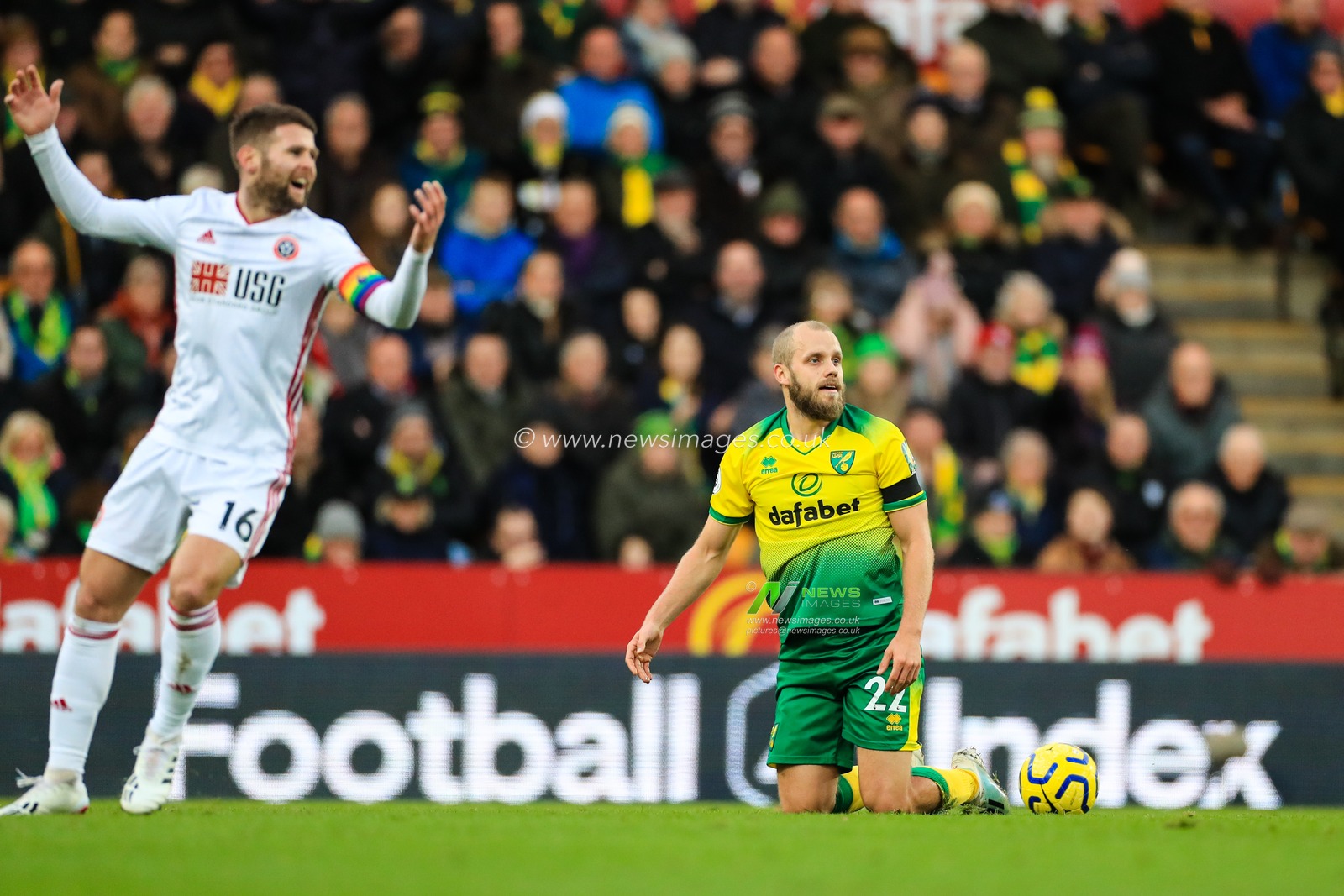 8th December 2019, Carrow Road, Norwich, England; Premier League, Norwich City v Sheffield United : Teemu Pukki (22) of Norwich City reacts to being brought down by Oliver Norwood (16) of Sheffield United 

Credit: Georgie Kerr/News Images