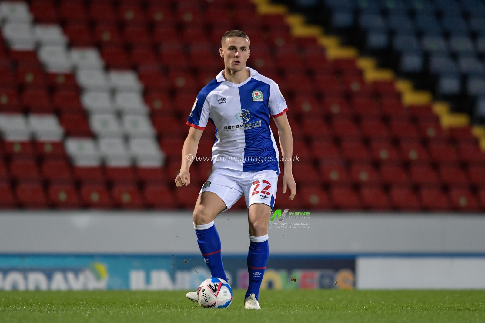 Taylor Harwood-Bellis #22 of Blackburn Rovers passes the ball