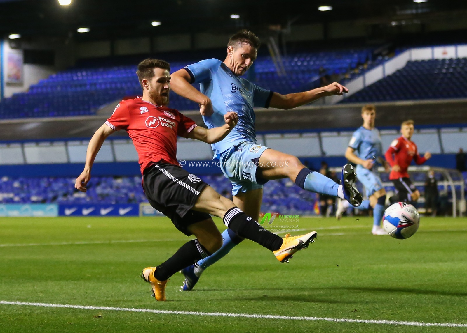 Tom Carroll of Queens Park Rangers crosses the ball