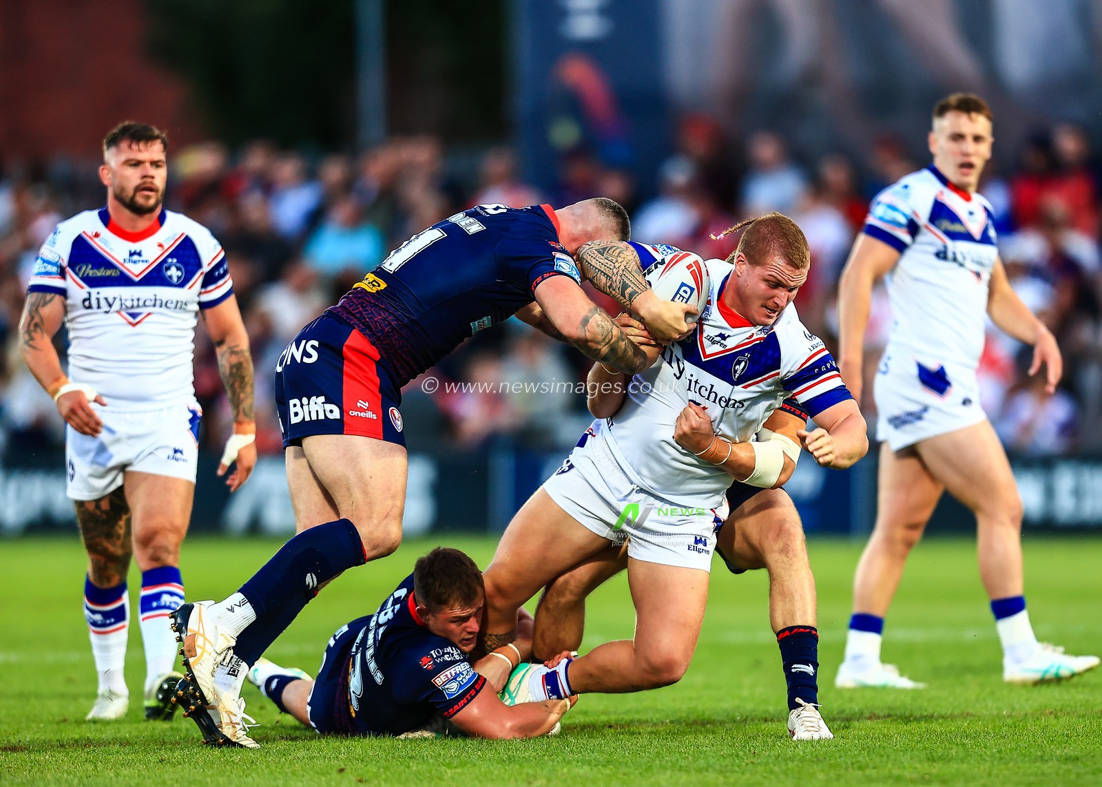 Caius Faatili of Wakefield Trinity is tackled during the Betfred Super League round 21 match Wakefield Trinity vs St Helens at DIY Kitchens Stadium, Wakefield, United Kingdom, 8th August 2025

(Photo by Richard Bierton/News Images)