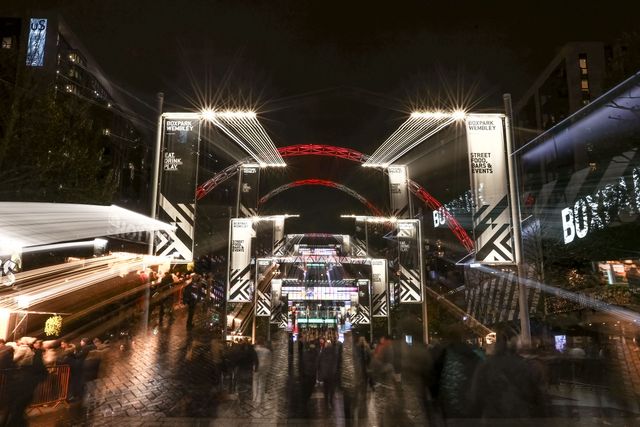 Fans make their way up Olympic Way as the Wembley Arch is lit on White and Red for England during the FIFA World Cup Qualifiers round 9 match England vs Serbia at Wembley Stadium, London, United Kingdom, 13th November 2025

(Photo by Alfie Cosgrove/News Images)

*** GER AUT SUI OUT ***