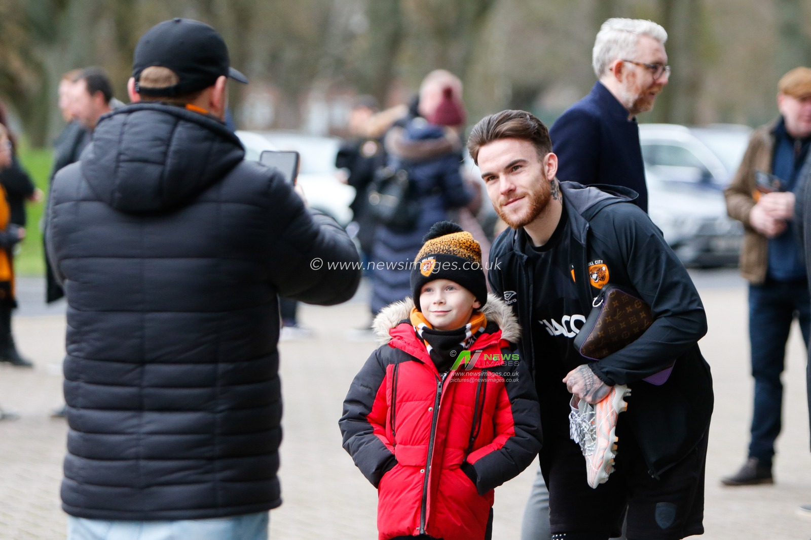 Aaron Connolly #44 of Hull City has pictures with a fan the Sky Bet Championship match Hull City vs Queens Park Rangers at MKM Stadium, Hull, United Kingdom, 28th January 2023

(Photo by Ben Early/News Images)
