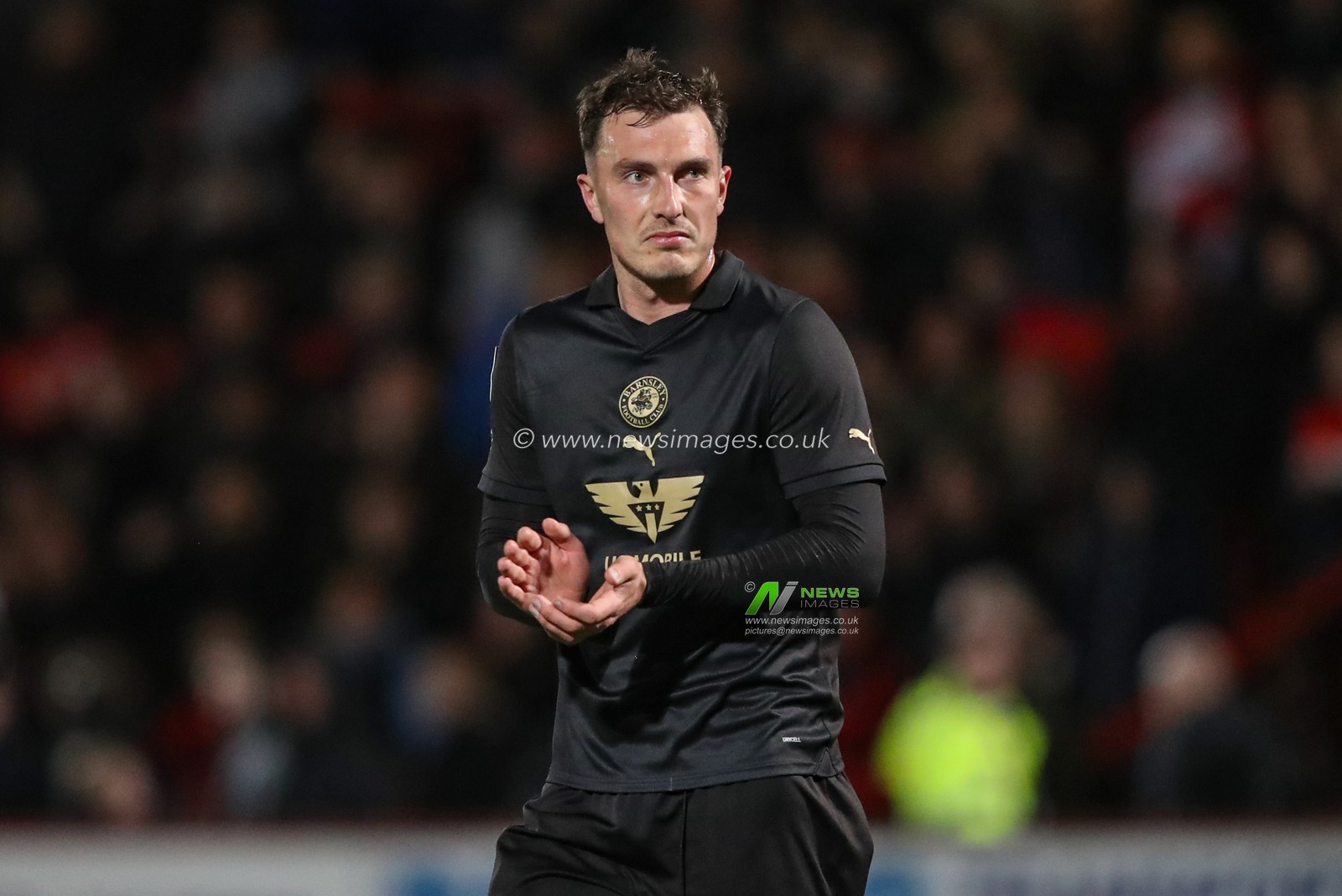 Josh Earl of Barnsley applauds the travelling fans after the game during the Sky Bet League 1 match Stevenage vs Barnsley at Lamex Stadium, Stevenage, United Kingdom, 9th April 2024

(Photo by Alfie Cosgrove/News Images)