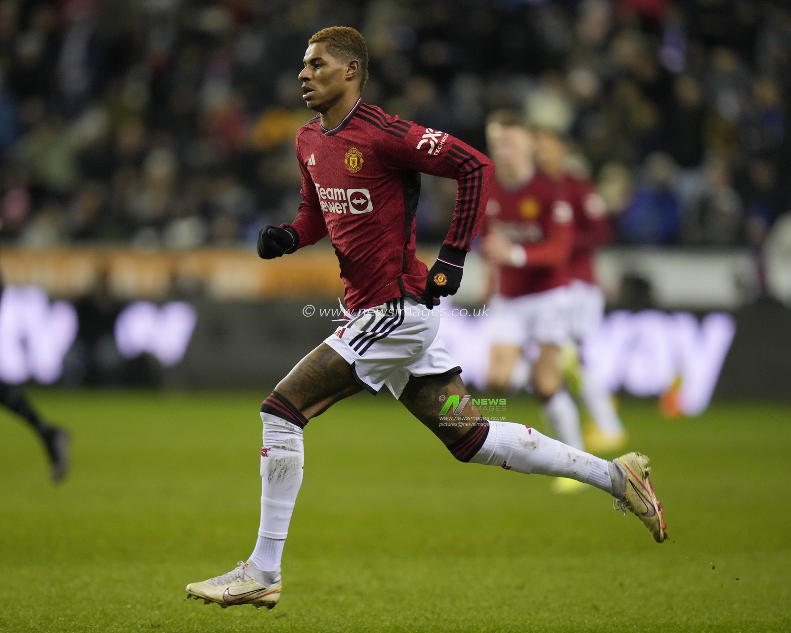 Marcus Rashford of Manchester United chases a ball during the Emirates FA Cup Third Round match Wigan Athletic vs Manchester United at DW Stadium, Wigan, United Kingdom, 8th January 2024

(Photo by Steve Flynn/News Images)