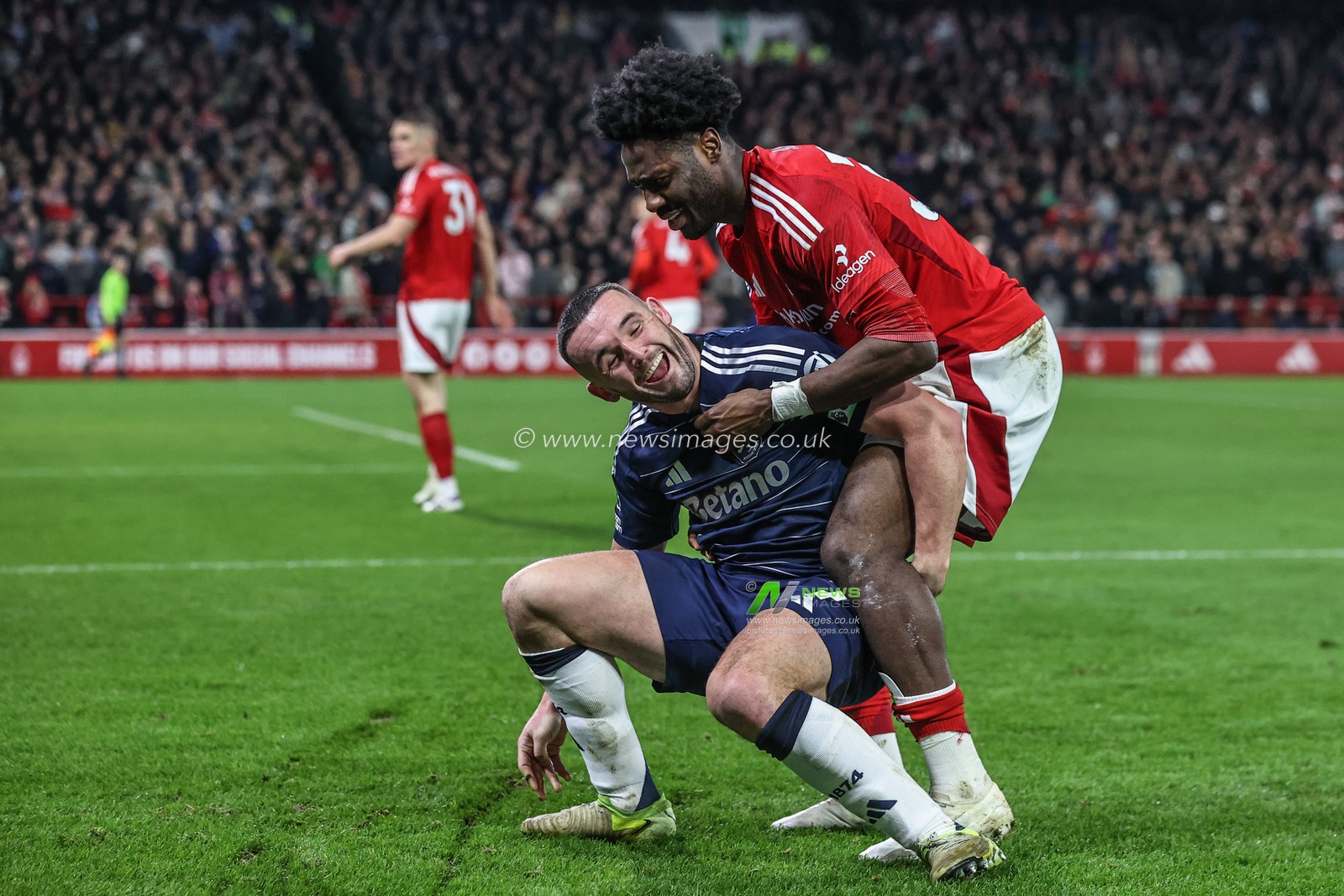 John McGinn of Aston Villa and Ola Aina of Nottingham Forest messing with each other after the ball goes out for a corner during the Premier League match Nottingham Forest vs Aston Villa at City Ground, Nottingham, United Kingdom, 14th December 2024

(Photo by Alfie Cosgrove/News Images)