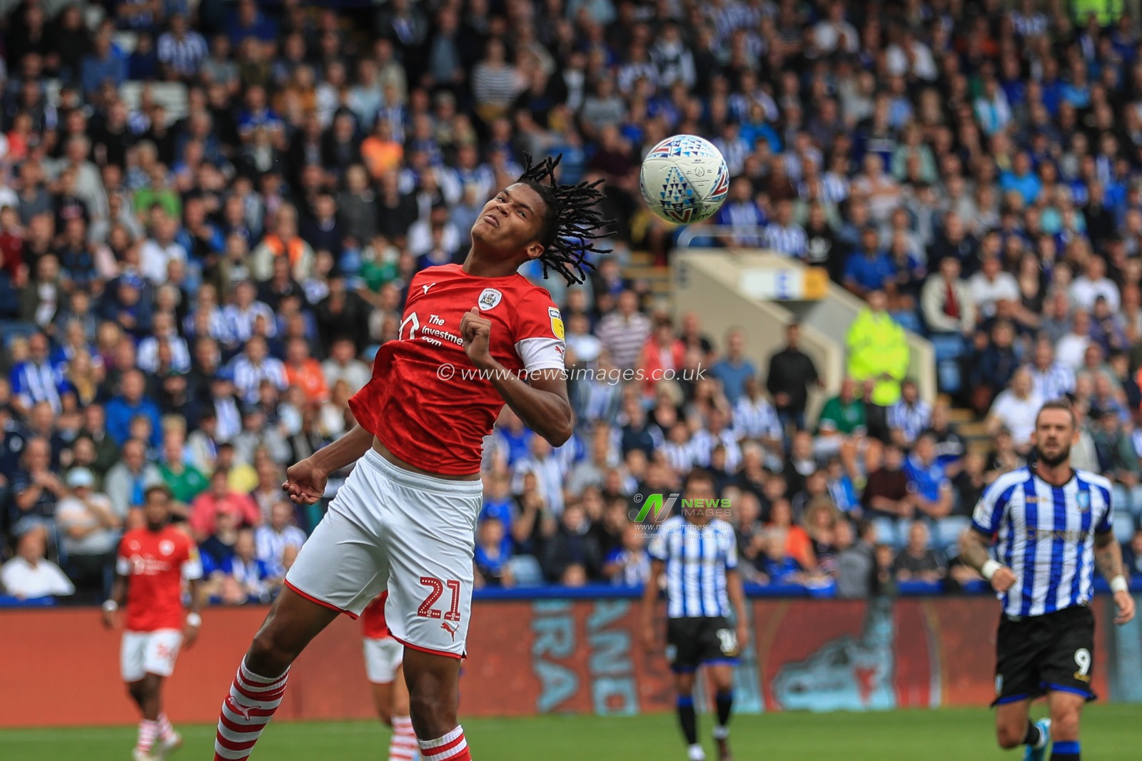 10th August 2019 , Hillsborough, Sheffield, England; Sky Bet Championship, Sheffield Wednesday vs Barnsley : Toby Sibbick (21) of Barnsley heads clear 

Credit: Mark Cosgrove/News Images,

English Football League images are subject to DataCo Licence