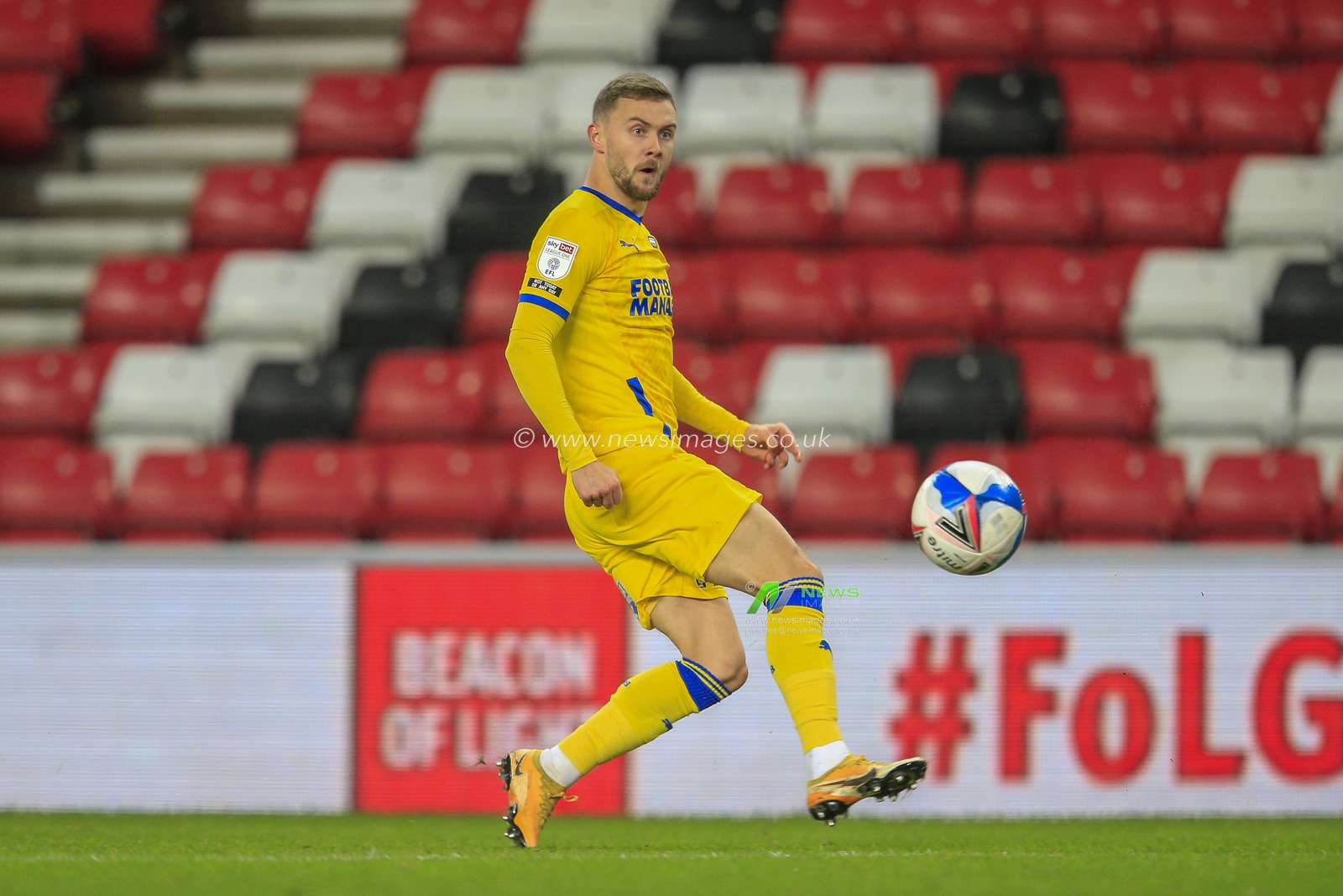 Shane McLoughlin #19 of AFC Wimbledon with the ball