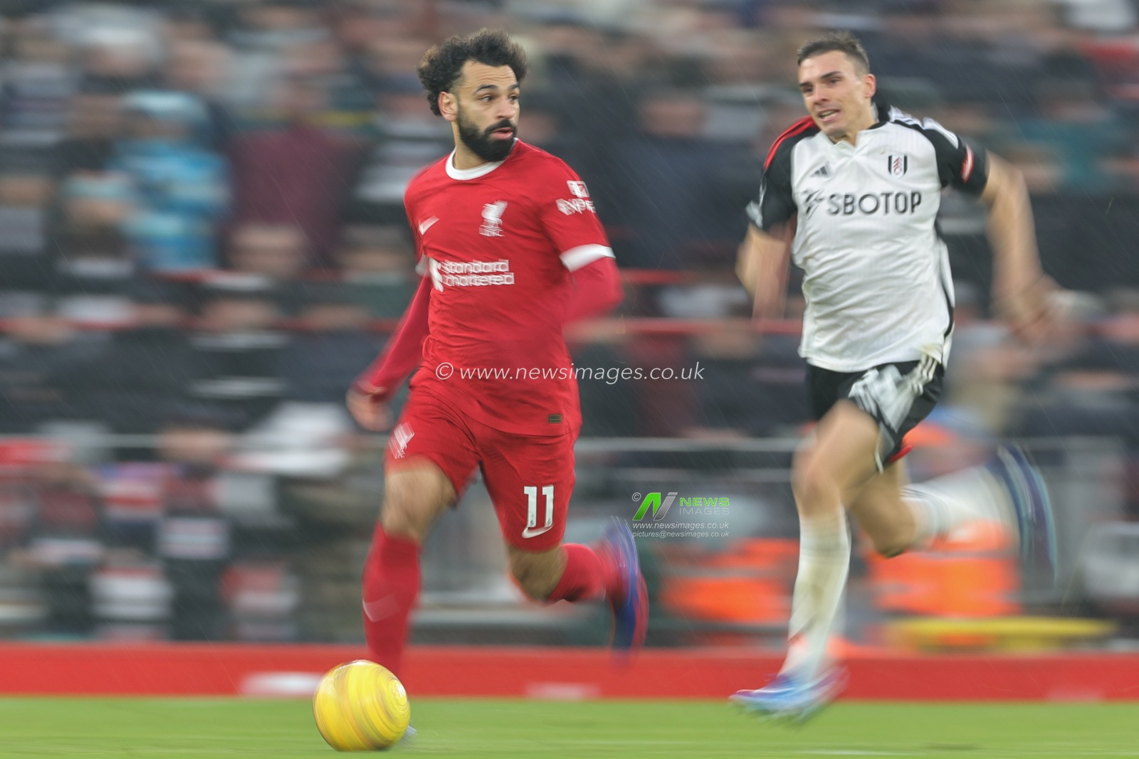Mohamed Salah #11 of Liverpool breaks with the ball during the Premier League match Liverpool vs Fulham at Anfield, Liverpool, United Kingdom, 3rd December 2023

(Photo by Mark Cosgrove/News Images)