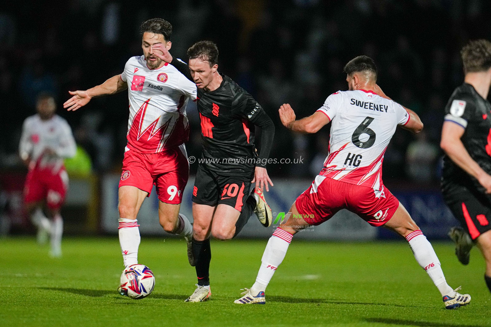 Kieran Dowell of Birmingham City is challenged by Louis AppÃ©rÃ© of Stevenage and Dan Sweeney of Stevenage during the Sky Bet League 1 match Stevenage vs Birmingham City at Lamex Stadium, Stevenage, United Kingdom, 24th April 2025

(Photo by Harvey Murphy/News Images)