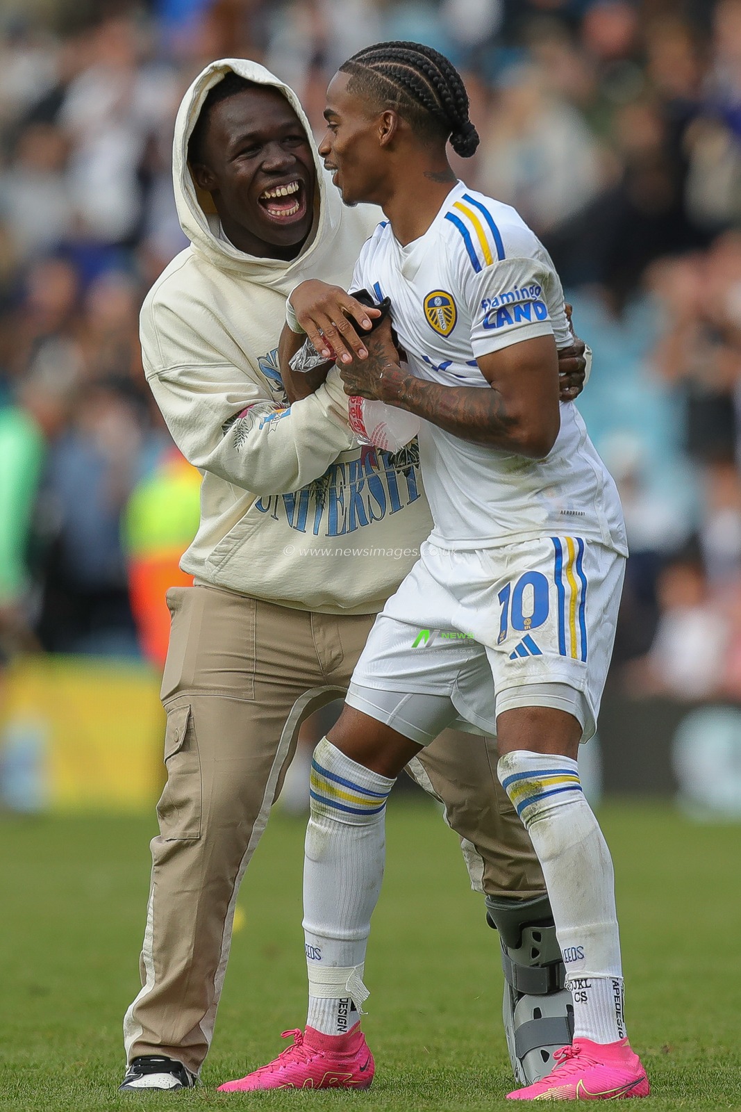 An injured Wilfried Gnonto #29 of Leeds United jokes with his team mate Crysencio Summerville #10 of Leeds United at full time after the Sky Bet Championship match Leeds United vs Watford at Elland Road, Leeds, United Kingdom, 23rd September 2023

(Photo by James Heaton/News Images)