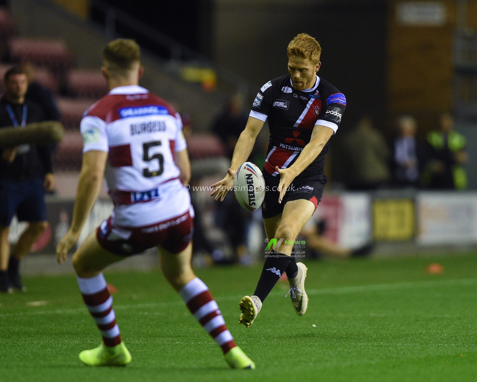 20th September 2019 , DW Stadium, Wigan, England;  Betfred Super League, Round  Playoffs, Wigan Warriors vs Salford Red Devils ; Kris Welham (3) of Salford Red Devils puts in an early kick for touch


Credit: Richard Long/News Images