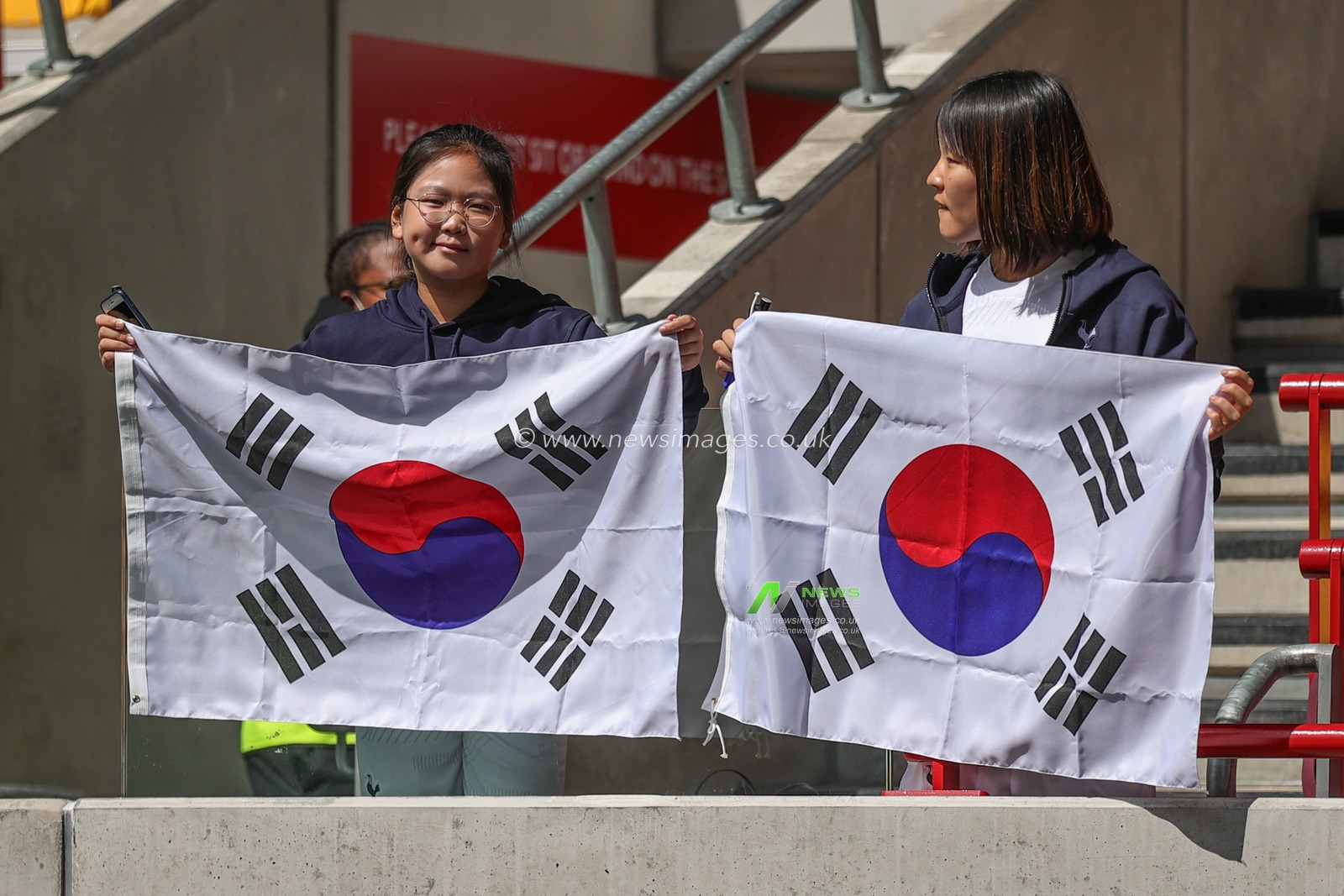 Two Tottenham fans hold up South Korean flags for Son Heung-min Tottenham Hotspur during the Premier League match Brentford vs Tottenham Hotspur at Brentford Community Stadium, London, United Kingdom, 13th August 2023

(Photo by Mark Cosgrove/News Images)