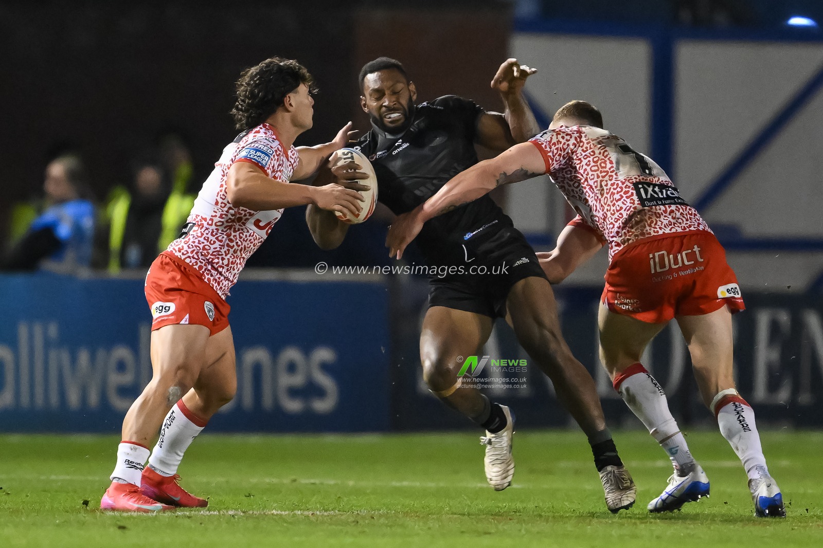 Rodrick Tai of Warrington Wolves is tackled by Jack Hughes of Leigh Leopards and Lachlan Lam of Leigh Leopards during the Toby King's Testimonial match Warrington Wolves vs Leigh Leopards at Halliwell Jones Stadium, Warrington, United Kingdom, 1st February 2025

(Photo by Craig Thomas/News Images)