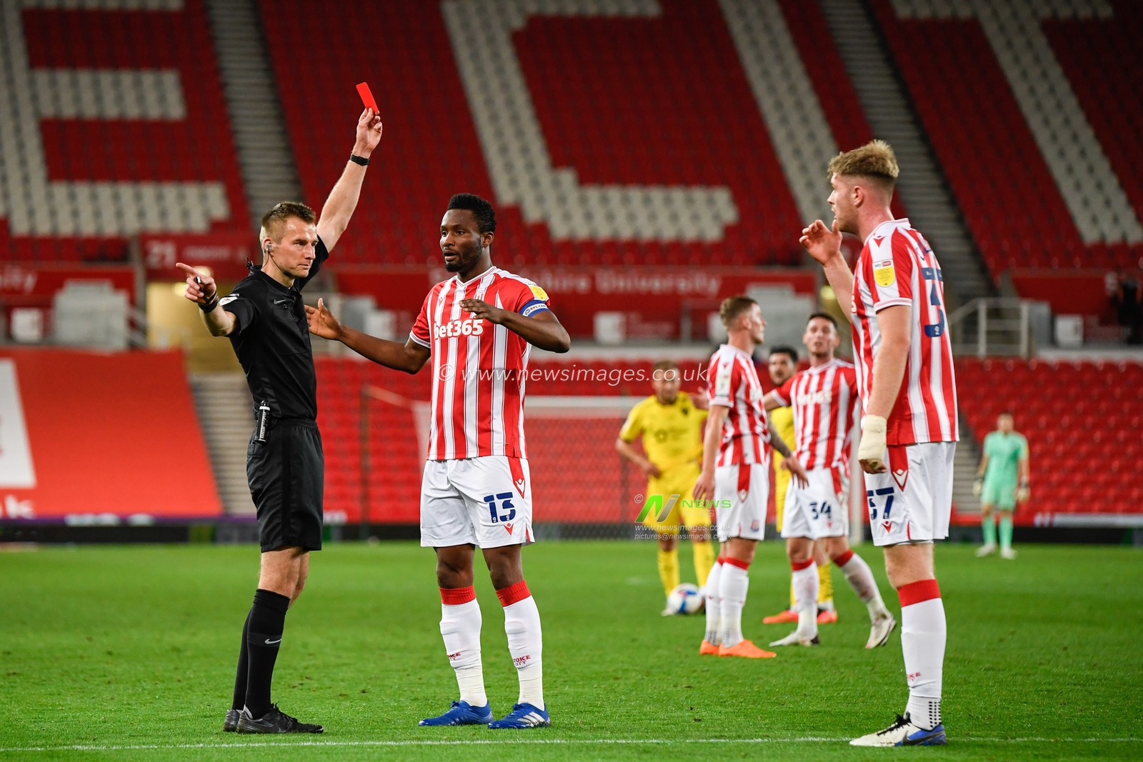 Referee, Michael Salisbury shows a red card to Nathan Collins (37) of Stoke City