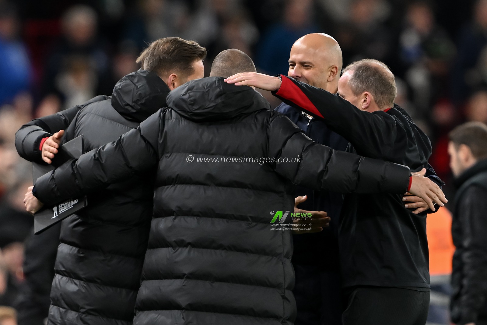 Arne Slot Head Coach of Liverpool celebrates the full time result with his coaching staff during the Premier League match Liverpool vs Brighton and Hove Albion at Anfield, Liverpool, United Kingdom, 2nd November 2024

(Photo by Cody Froggatt/News Images)