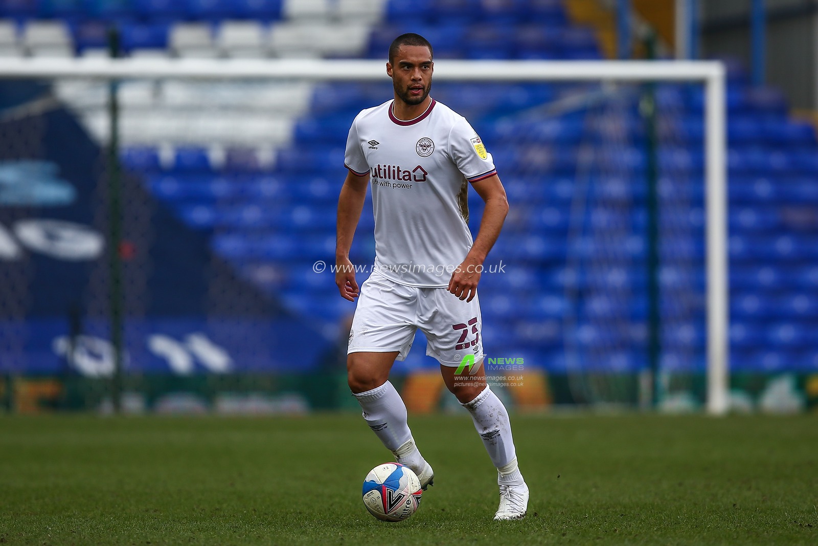 Winston Reid #23 of Brentford dribbles the ball