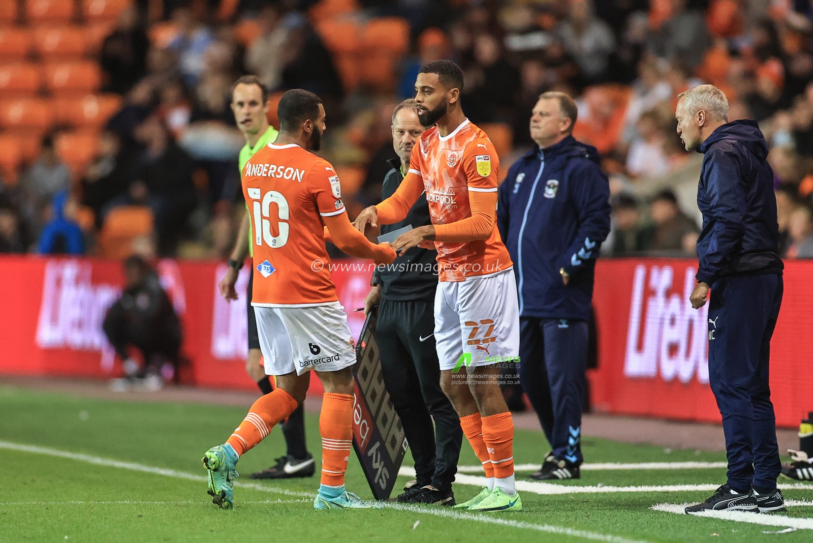 Keshi Anderson #10 of Blackpool gives way for Cj Hamilton #22 of Blackpool