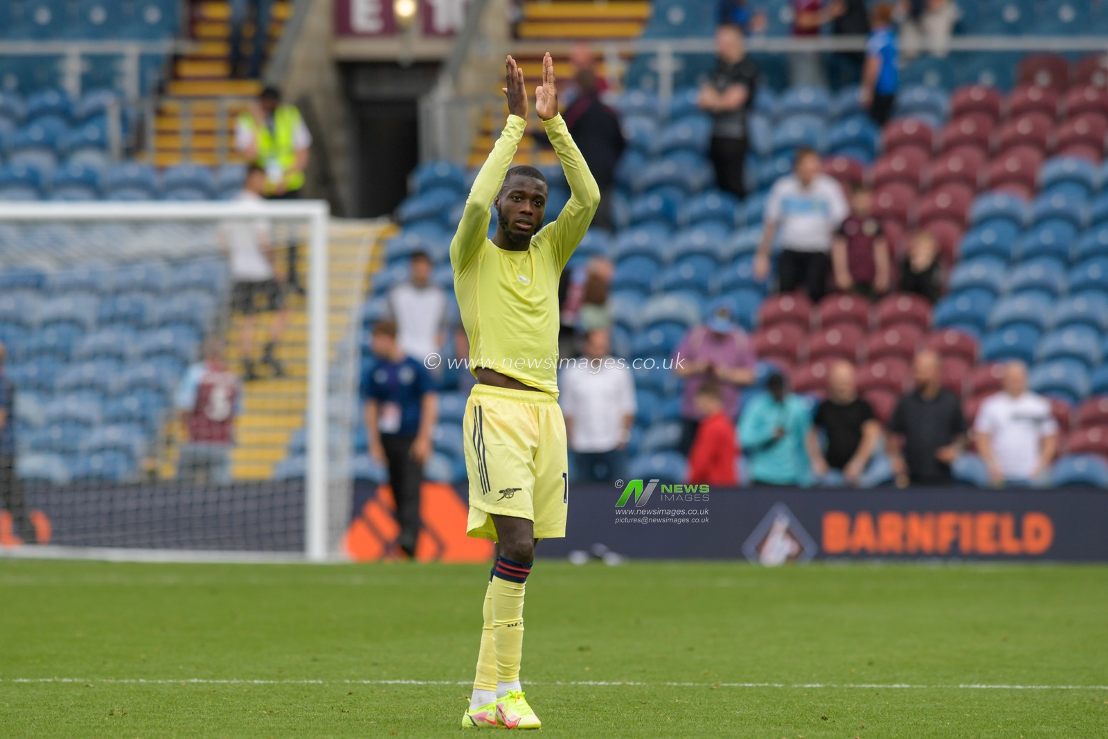 Nicolas Pepe #19 of Arsenal applauds the travelling supporters at the end of the game after beating Burnley 0-1