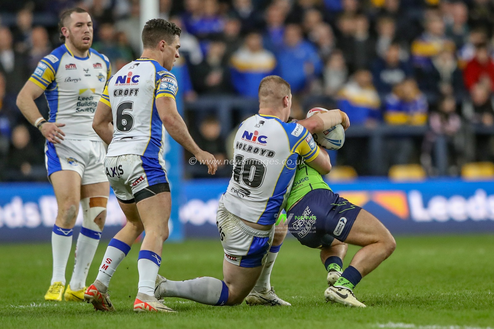 Danny Walker of Warrington Wolves is tackled by Tom Holroyd of Leeds Rhinos during the Betfred Super League Round 7 match Leeds Rhinos vs Warrington Wolves at Headingley Stadium, Leeds, United Kingdom, 5th April 2024

(Photo by Alfie Cosgrove/News Images)