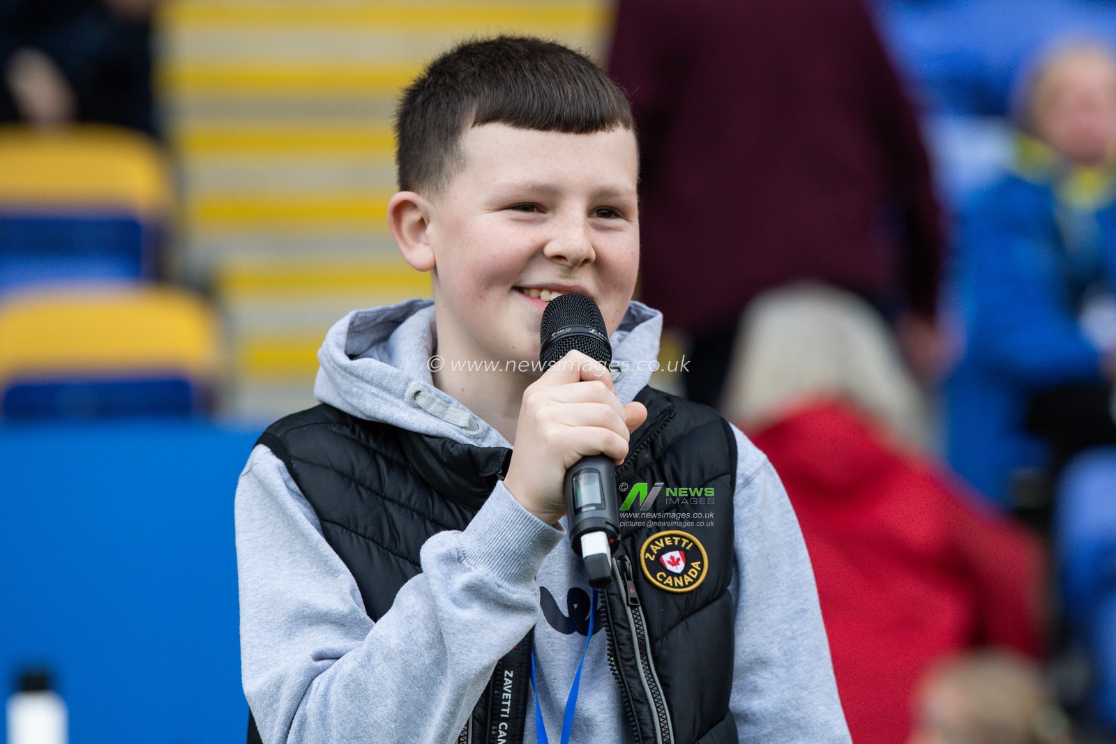 A young announcer reads out the teams ahead of the Betfred Super League Round 11 match Warrington Wolves vs Wakefield Trinity at Halliwell Jones Stadium, Warrington, United Kingdom, 5th May 2023

(Photo by Craig Thomas/News Images)